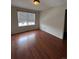 Bedroom with window letting in natural light at 1129 S Duquesne Cir, Aurora, CO 80018