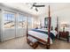 Comfortable bedroom with four poster bed, ceiling fan and natural light from three windows at 3751 W 136Th Ave # S3, Broomfield, CO 80023
