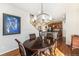 Cozy dining area open to the kitchen, featuring a modern chandelier and hardwood floors, perfect for entertaining at 3751 W 136Th Ave # S3, Broomfield, CO 80023