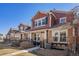 Street view of well-maintained townhomes, showcasing harmonious design, stone accents, and manicured landscaping at 3751 W 136Th Ave # S3, Broomfield, CO 80023
