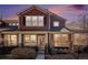 Beautiful townhome featuring stone accents, neutral-colored siding, black shutters, and a well-manicured front yard at 3751 W 136Th Ave # S3, Broomfield, CO 80023