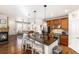 Open kitchen view with granite counters, stainless appliances and adjacent living area at 3751 W 136Th Ave # S3, Broomfield, CO 80023