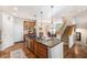 Kitchen featuring a large island, stainless steel appliances, and adjacent dining area at 3751 W 136Th Ave # S3, Broomfield, CO 80023