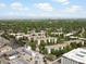 Wide aerial shot showcasing the community amidst lush greenery and distant mountain views at 3470 S Poplar St. # 110, Denver, CO 80224