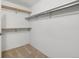 Spacious walk-in closet featuring neutral carpet and multiple shelves for ample storage at 3470 S Poplar St. # 110, Denver, CO 80224