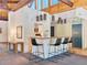 Clubhouse seating area with bar, countertop, and view of kitchen with modern appliances at 3470 S Poplar St. # 110, Denver, CO 80224