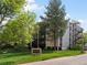 Exterior of the Morningside Condominiums building showcasing well-maintained landscaping at 3470 S Poplar St. # 110, Denver, CO 80224