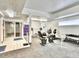 Well-equipped gym with various exercise machines and weights, promoting an active lifestyle at 3470 S Poplar St. # 110, Denver, CO 80224