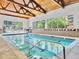 Indoor pool with beautiful ceiling and large windows with natural light, with tile floor at 3470 S Poplar St. # 110, Denver, CO 80224
