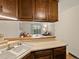 View from the kitchen to the living room, showing the breakfast bar and layout at 3470 S Poplar St. # 110, Denver, CO 80224