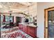 Open concept living space with kitchen and dining area featuring a wood plank ceiling at 68 N Ponderosa Way, Evergreen, CO 80439