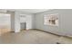 Cozy bedroom with neutral walls, carpet, and window view at 7560 S Biloxi Ct, Aurora, CO 80016