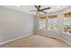 Bedroom with natural light, ceiling fan and carpeted floors at 7560 S Biloxi Ct, Aurora, CO 80016