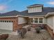 Charming ranch-style home featuring a brick facade, attached garage, and landscaped front yard at 7560 S Biloxi Ct, Aurora, CO 80016