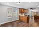 Eat-in kitchen features wood cabinetry, granite countertops, and stainless-steel appliances at 7560 S Biloxi Ct, Aurora, CO 80016