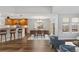 Inviting living room with hardwood floors, opening to the kitchen and dining areas at 7560 S Biloxi Ct, Aurora, CO 80016