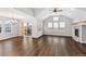 Spacious living room with wood floors, vaulted ceilings, and fireplace at 7560 S Biloxi Ct, Aurora, CO 80016