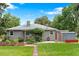 Well-maintained backyard featuring a manicured lawn, garden area, shed and mature trees, perfect for outdoor enjoyment at 6755 W 45Th Ave, Wheat Ridge, CO 80033