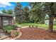 Landscaped backyard with lush lawn, mature trees, decorative rock gardens, shed and a swing set for outdoor enjoyment at 6755 W 45Th Ave, Wheat Ridge, CO 80033