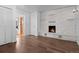 Finished basement features wood floors, brick fireplace, neutral walls, and access to the upstairs at 6755 W 45Th Ave, Wheat Ridge, CO 80033