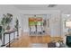 Open-concept living and dining area with hardwood floors, natural light, and modern furnishings at 6755 W 45Th Ave, Wheat Ridge, CO 80033