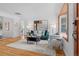 Stylish living room featuring hardwood floors, natural light, modern decor, and a cozy seating area at 6755 W 45Th Ave, Wheat Ridge, CO 80033