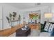 Open-concept living and dining area with hardwood floors, natural light, and modern furnishings at 6755 W 45Th Ave, Wheat Ridge, CO 80033
