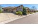 Beautiful home with a well-maintained yard, a spacious driveway, and stone accents on the facade at 7580 S Biloxi Ct, Aurora, CO 80016