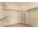 Walk-in closet with carpet and installed shelving at 7580 S Biloxi Ct, Aurora, CO 80016