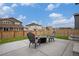 Backyard patio area with a fire pit and seating, perfect for outdoor entertaining at 14818 Dahlia St, Thornton, CO 80602