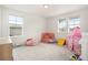 Spacious bedroom with large windows and ample play area at 14818 Dahlia St, Thornton, CO 80602