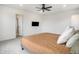 Bright primary bedroom with a ceiling fan and an attached bathroom at 14818 Dahlia St, Thornton, CO 80602