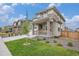 Charming two-story home featuring stone accents, a cozy front porch, and well-maintained landscaping at 14818 Dahlia St, Thornton, CO 80602