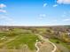 Aerial view of a park with walking paths, a playground, and sports fields in a community at 13041 Reata Ridge Dr, Parker, CO 80134