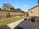 Backyard with patio, grass, fence, and retaining wall at 13041 Reata Ridge Dr, Parker, CO 80134