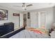 Neutral bedroom with ceiling fan and easy access to bathroom at 13041 Reata Ridge Dr, Parker, CO 80134