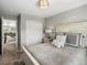 A bedroom featuring a queen-sized bed, a closet, and a staircase leading to another floor at 13041 Reata Ridge Dr, Parker, CO 80134