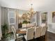 Elegant dining room featuring a chandelier, hardwood floors, and natural light at 13041 Reata Ridge Dr, Parker, CO 80134