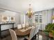 Elegant dining room featuring a chandelier, hardwood floors, and natural light at 13041 Reata Ridge Dr, Parker, CO 80134