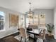 Dining room with a large dark wood table and a patterned rug at 13041 Reata Ridge Dr, Parker, CO 80134