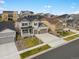Aerial view of a charming two-story home with a three-car garage and beautiful landscaping at 13041 Reata Ridge Dr, Parker, CO 80134