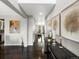 Inviting entryway featuring hardwood floors, neutral paint, and tasteful decor at 13041 Reata Ridge Dr, Parker, CO 80134