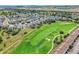 Aerial view of the neighborhood near a picturesque golf course, highlighting its recreational appeal at 1388 Castle Creek Cir, Castle Rock, CO 80104