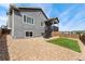 The house's back exterior features a deck and stairs, blending indoor and outdoor living seamlessly at 1388 Castle Creek Cir, Castle Rock, CO 80104