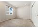 Bright bedroom features plush carpet, large window and closet with sliding doors at 1388 Castle Creek Cir, Castle Rock, CO 80104