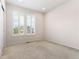 Empty bedroom with carpet, natural light and blinds at 1388 Castle Creek Cir, Castle Rock, CO 80104