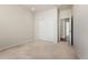 Cozy carpeted bedroom boasts neutral walls and offers a closet and entry to the hallway at 1388 Castle Creek Cir, Castle Rock, CO 80104