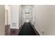 Inviting hallway with hardwood floors and neutral paint at 1388 Castle Creek Cir, Castle Rock, CO 80104