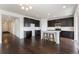 Contemporary kitchen with a center island and dark cabinets at 1388 Castle Creek Cir, Castle Rock, CO 80104