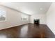 Spacious living room with fireplace and plantation shutters at 1388 Castle Creek Cir, Castle Rock, CO 80104